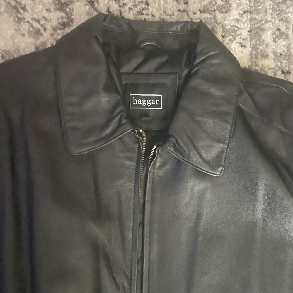 Never worn Black Haggar genuine leather coat. Mint condition. Size large.